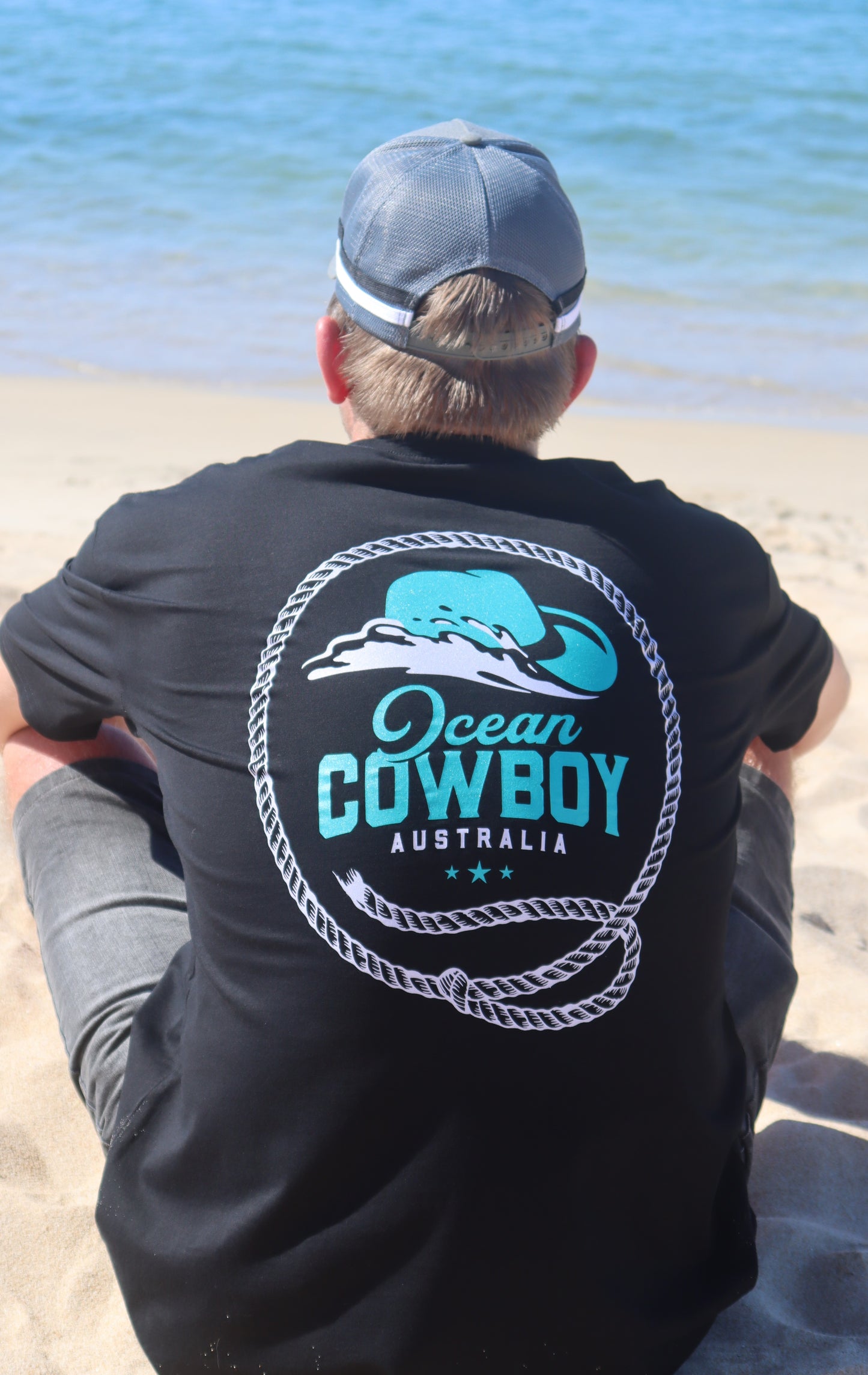 Ocean Cowboy Black Tee - Teal Logo