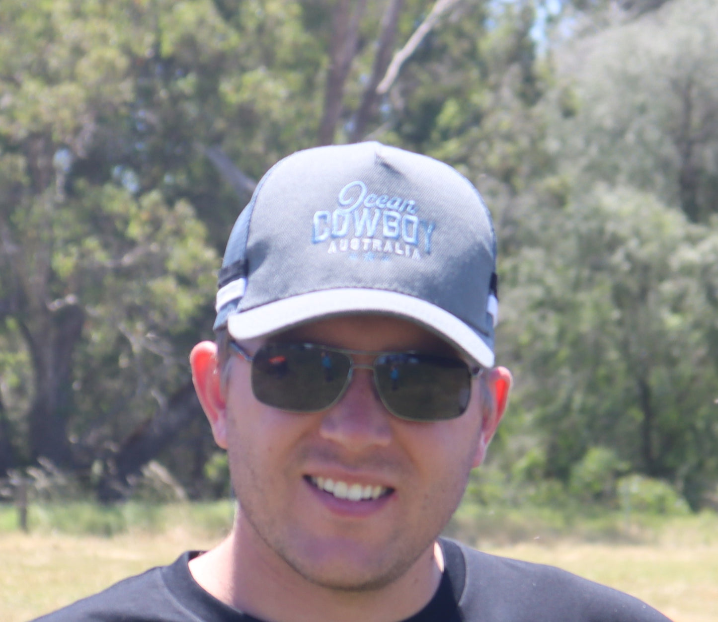 Ocean Cowboy - Grey Trucker Cap - Blue Text Logo