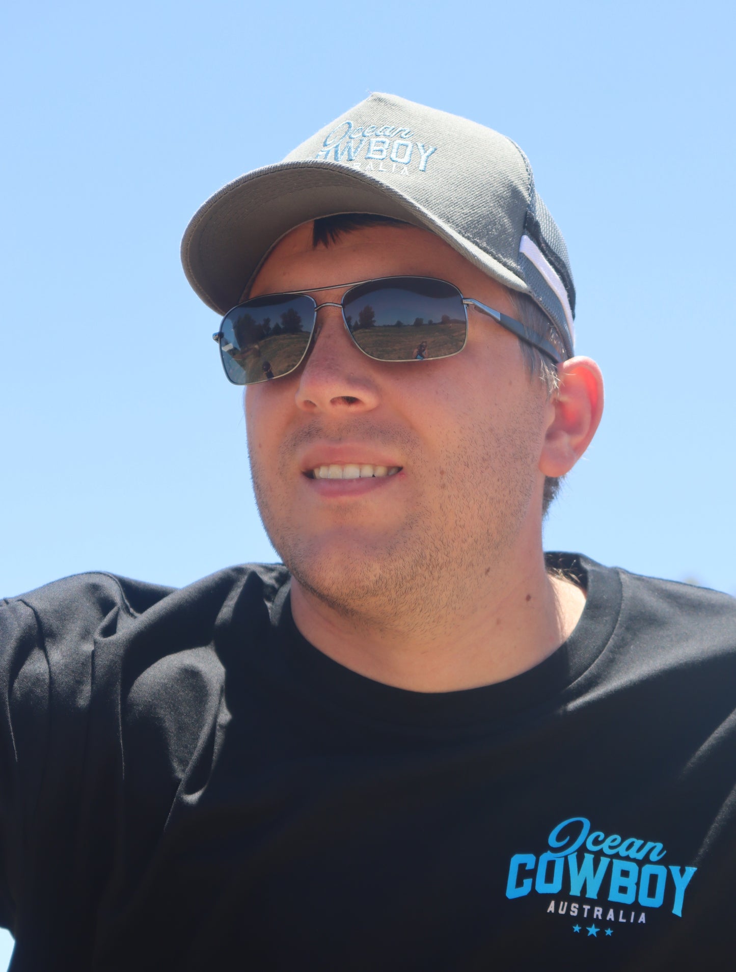 Ocean Cowboy Black Tee - Blue Logo