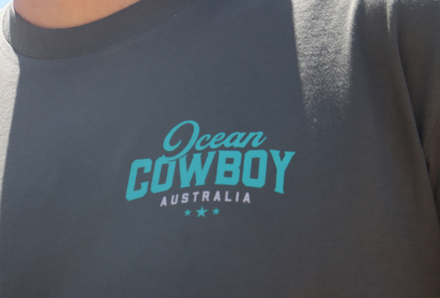 Ocean Cowboy Charcoal Tee - Teal Logo