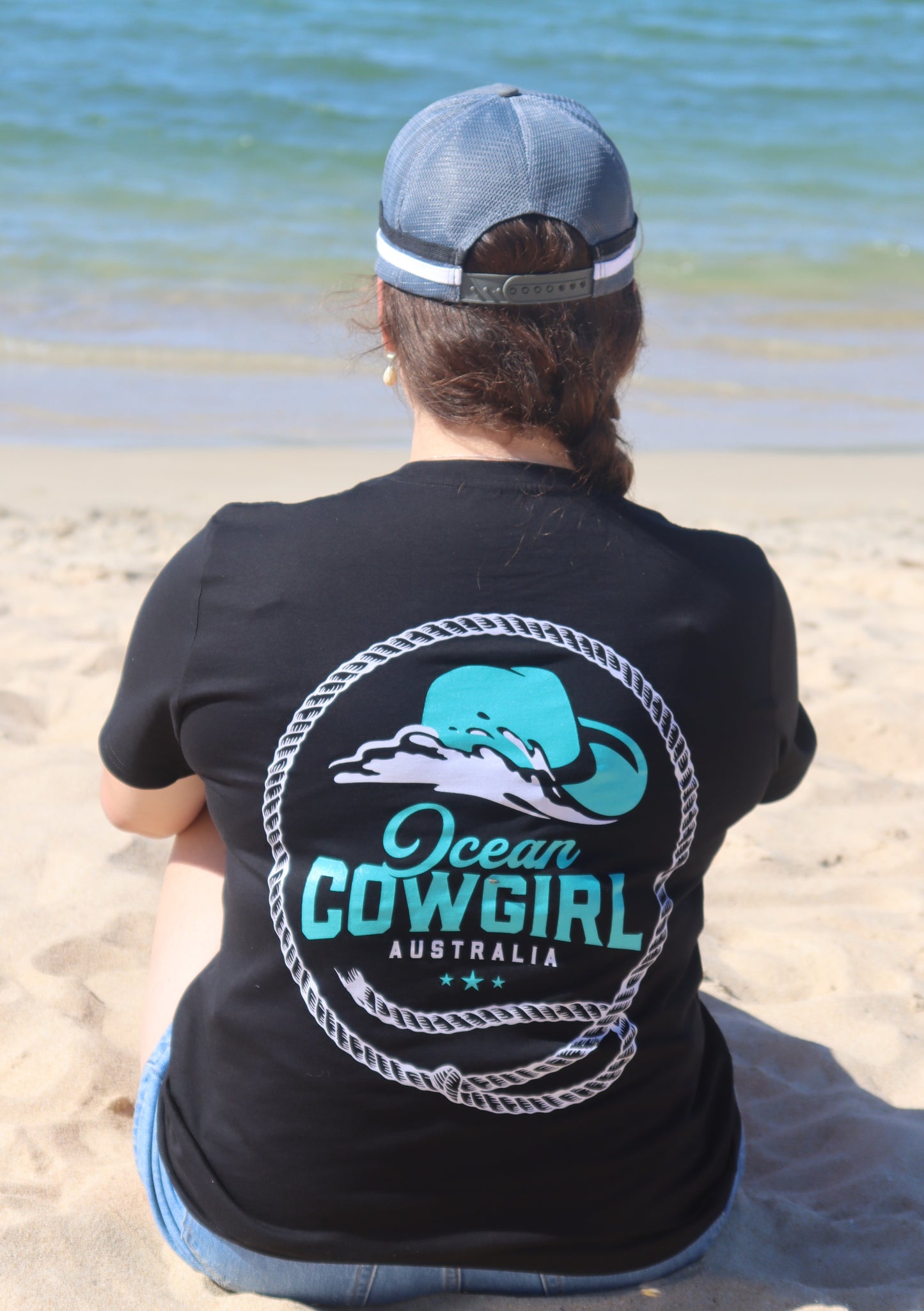 Ocean Cowgirl Black Tee - Teal Logo